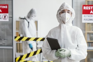 woman-protective-suit-holding-tablet-2-2